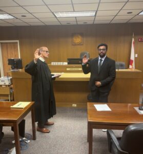 Associate Attorney, Vamsi Karanam, being sworn in.
